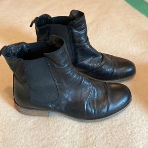 Black leather bootie with ruching in front. Elastic gusset. Gently worn.